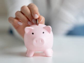 coin going into piggy bank