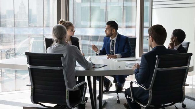 personal injury attorney at table with insurance company